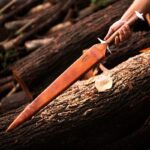 Ergonomic rosewood handle of Roman Gladius sword with brass detailing